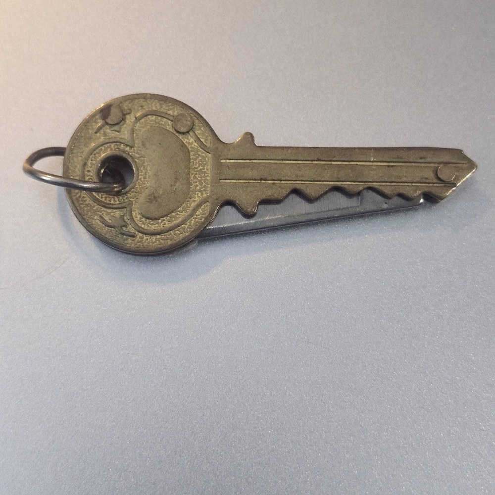 vintage key-shaped pocket knife, sometimes called a "key knife" or folding knife